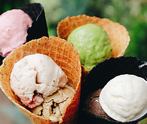 National-Ice-Cream-Day-A-Day-of-Frozen-Delights-image 5 4 different coloured scoops of ice cream in cones frosted fusions
