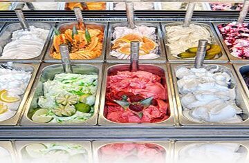 Gelato-vs-Ice-Cream-Isnt-it-the-same-thing-featured-image-200x600w-selection-of-gelatos-lined-up-in-large-display-trays-frosted-fusions