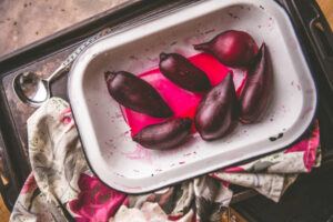Homemade-Beetroot-Ice-Cream-Naturally-Sweet-Vibrant-image-7-landscape-tray-of-roasted-beetroot-with-bright-beetroot-juice-frosted-fusions