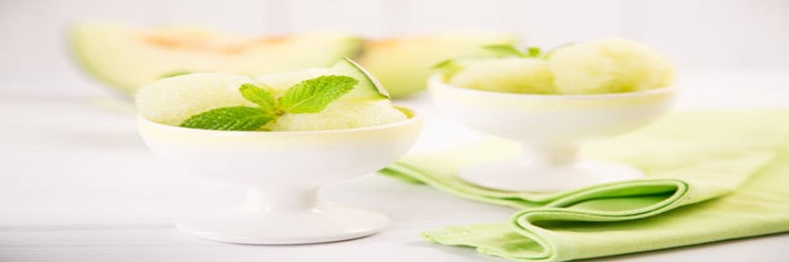 Honeydew-Melon-Sorbet-A-Refreshing-Healthful-Dessert-featured-image-200x600w-2-white-dishes-with-scoops-of-honeydew-sorbet-with-halves-of-honeydew-melon-in-the-background-frosted-fusions