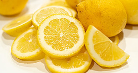 Luscious Lemon Sorbet Zesty Citrus Bliss image 2 jpeg Pile of sliced and whole lemons frosted fusions