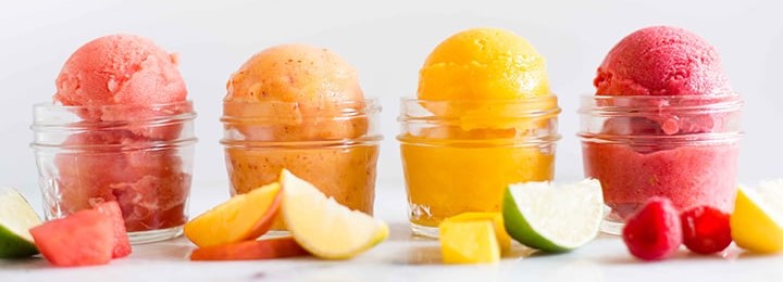 Sensational Sorbet A Guide to Making Homemade Zingy Delights featured jpeg 4 refreshing sorbets with fresh fruit lined up frosted fusions