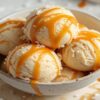 A Homemade Salted Caramel Ice Cream Recipe featured image 637x1920w update Jun25 bowl of salted caramel ice cream with caramel drizzled atop Frosted Fusions