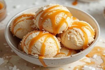 A Homemade Salted Caramel Ice Cream Recipe featured image 637x1920w update Jun25 bowl of salted caramel ice cream with caramel drizzled atop Frosted Fusions