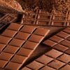 Easy-Homemade-Chocolate-Ice-Cream-Recipe-featured-image-200x600w-slabs-of-chocolate-and-cacao-seeds-and-cocoa-powder-frosted-fusions