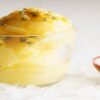 Passion-Fruit-Sorbet-A-Sweet-and-Tangy-Tropical-Dessert-featured-image-200x600w-passion-fruit-sorbet-in-glass-dish-with-half-a-passion-fruit-to-the-side-on-ice-frosted-fusions