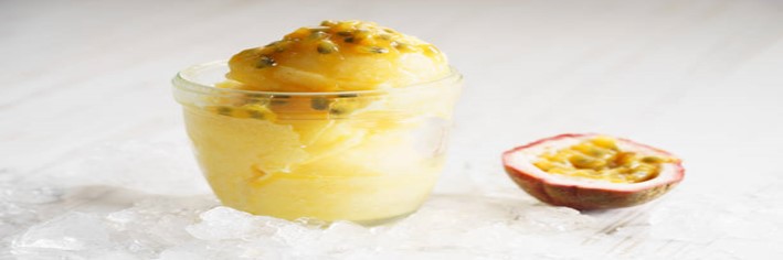 Passion-Fruit-Sorbet-A-Sweet-and-Tangy-Tropical-Dessert-featured-image-200x600w-passion-fruit-sorbet-in-glass-dish-with-half-a-passion-fruit-to-the-side-on-ice-frosted-fusions