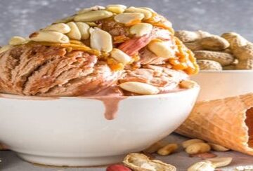A-Homemade-Peanut-Butter-Ice-Cream-featured-image-cropped-207x620w-white-bowl-of-peanut-butter-ice-cream-with-lots-of-shelled-peanuts-around-frosted-fusions