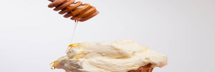 Balancing-Flavour-and-Health-Natural-Sweeteners-in-Your-Homemade-Ice-Cream-featured-image-200x594w-jpeg-honey-dipper-drizzling-honey-over-ice-cream-scoop-in-cone-frosted-fusions
