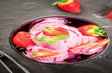 Berry-Bliss-A-Healthy-Homemade-Strawberry-Frozen-Yoghurt-featured-image-200x600w-jpeg-strawberry-froyo-in-dark-dish-top-view-with-ice-cream-scoop-and-fresh-strawberries-scattered-frosted-fusions