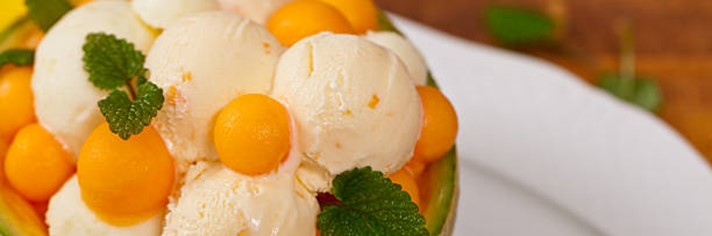 Deliciously-Refreshing-Homemade-Apricot-and-Thyme-Ice-Cream-Recipe-featured-image-200x600w-jpeg-apricot-ice-cream-with-balls-of-fresh-apricot-and-green-leaves-frosted-fusions