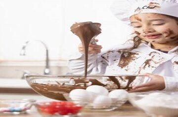 Fun Ice Cream Recipes for Kids Involving Children in Homemade Creations featured image 200x600w jpeg young child in chefs whites covered in chocolate with ladle and mixing bowl frosted