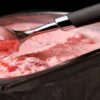 Mastering-Homemade-Ice-Cream-Using-Ice-Cream-Makers-Techniques-and-Tips-featured-image-200x695w-tray-of-pink-ice-cream-being-scooped-with-baller-frosted-fusions