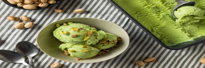 Nutty-Bliss-A-Creamy-Homemade-Pistachio-Ice-Cream-featured-image-200x600w-pistachio-ice-cream-with-pistachios-scattered-frosted-fusions