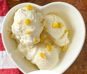 A Cornucopia of Flavours Homemade Sweet Corn Ice Cream image 4 Sweet corn ice cream in heart dish with corn kernals scattered frosted fusions