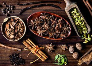 autumnal-perfection-homemade-pumpkin-ice-cream-recipe-image-5-selection-of-spices-vanilla-cinnamon-sticks-cloves-nutmeg-frosted-fusions