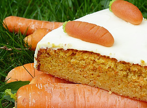 Getting to the Root of it A Carrot Sorbet Sensation image 4 carrot cake sat on raw carrots with decorative carrots on top frosted fusions