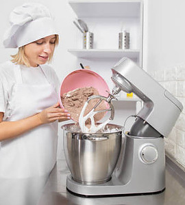 Mastering Homemade Ice Cream Using Ice Cream Makers Techniques and Tips image 1 woman pouring ice cream misture into ice cream machine frosted fusions