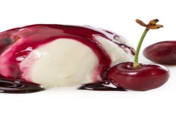 Homemade-Cherry-Amaretto-Ice-Cream-featured-image-200x600w-single-scoop-of-ice-cream-drizzled-with-cherry-coulis-and-2-fresh-cherries-with-stalks-white-background-frosted-fusions