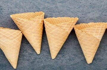 Mastering-the-Art-Make-Homemade-Ice-Cream-Cones-featured-image-200x600w-6-ice-cream-cones-laid-out-dark-background-frosted-fusions