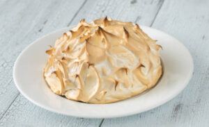 Homemade-Baked-Alaska-Its-the-Bomb-image-4-complete-baked-alaska-with-charred-meringue-on-white-plate-frosted-fusions