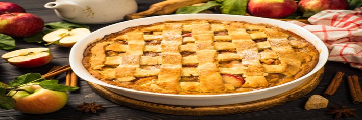 Spiced-Apple-Homemade-Ice-Cream-A-Twist-on-a-Classic-Pie-Favourite-featured-image-200x600w-latticed-apple-pie-with-fresh-apples-and-cinnamon-sticks-scattered-frosted-fusions