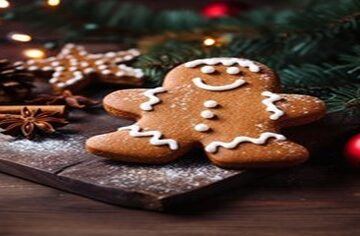 Spice up the Season Festive Homemade Gingerbread Ice Cream featured image 200x600w gingerbread man decorated with cinnamon rolls and festive decorations on wooden chopping board dark background frosted fusions