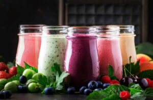 New-Year-Fresh-Vibes-Nourish-Your-Body-With-Healthful-Smoothies-updated-jan25-image-10-smoothies-lined-with-with-a-selection-of-fruits-and-berries-frosted-fusions