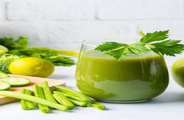Revitalise And Refresh The Ultimate Detox Green Smoothie featured image 200x600w green smoothie in glass with several ingredients surrounding it including spinach leaves lime apple celery broccoli cucumber frosted fusions