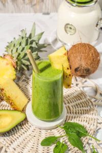 Revitalise-And-Refresh-The-Ultimate-Detox-Green-Smoothie-image-8-Green-smoothie-with-fresh-spinach-leaves-avocado-pineapple-and-coconut-frosted-fusions