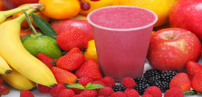 A Delicious And Nutrient-Packed Berry Blast Smoothie image 10 red berry smoothie surro9unded by a selection of ingredients used to make including strawbs rasps apples bananas frosted fusions