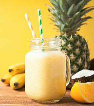 How To Make The Perfect Smoothie image 11 fresh pineapple bananas coconut and orange and smoothie with straws frosted fusions