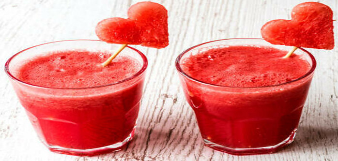 How To Make The Perfect Smoothie image 13 two red smoothies in glasses with fruit cut out in heart shapes frosted fusions
