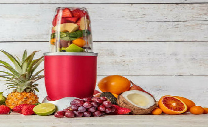 New Year, Fresh Vibes: Nourish Your Body With Healthful Smoothies 5 blender full of fresh fruit with huge selection of fresh fruits surrounding the blender frosted fusions