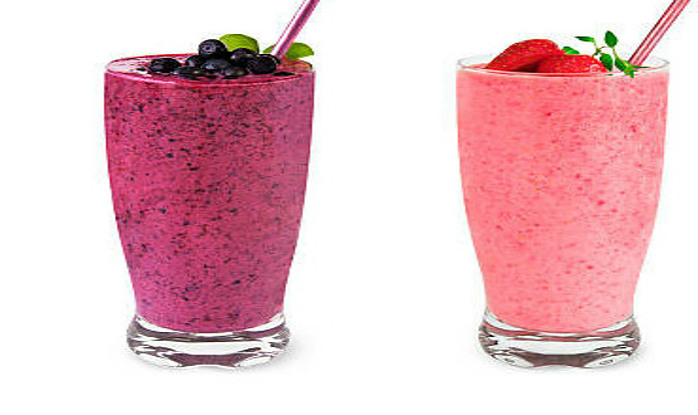 New Year, Fresh Vibes: Nourish Your Body With Healthful Smoothies image 2 three smoothies in tall glasses lined up with berries and fresh leaves on top and straws frosted fusions
