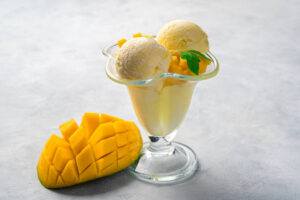 Sweet-Treats-For-Mum-Homemade-Ice-Cream-To-Celebrate-Mothers-Day-image-7-coconut-and-mango-sorbet-in-glass-dish-with-fresh-mango-frosted-fusions