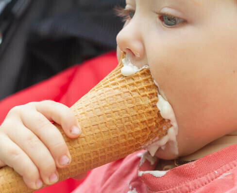 Can I Give My Baby Ice Cream image 1 young baby with ice cream in hand frosted fusions