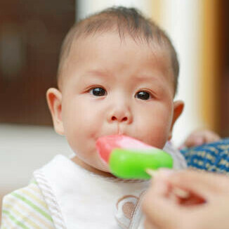 Can I Give My Baby Ice Cream image 13 gorgeous baby being fed a fruit sorbet lollipop frosted fusions