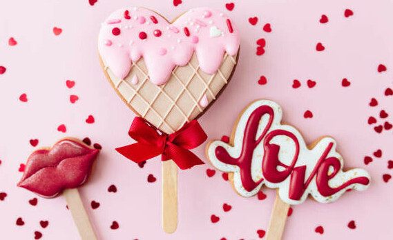 Homemade Ice Cream Treats For Valentines Day image 4 Shaped biscuits heart lips and love sign with heart sprinkles in background frosted fusions