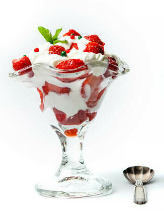  Strawberries And Cream Homemade Parfait Ice Cream image 4 parfait with strawberries and cream in dessert glass with spoon to the side and sprig of fresh leaves frosted fusions