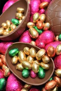 easter-eggs-travaganza-homemade-easter-egg-ice-cream-ideas-image-7-easter-egg-halved-with-lots-of-smaller-wrapped-eggs-sitting-in-each-half-frosted-fusions