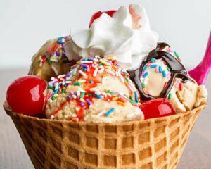 easter-sundae-fundae-homemade-ice-cream-ideas-for-easter-image-11-ice-cream-sundae-in-ice-cream-cone-toped-with-colourful-toppings-frosted-fusions