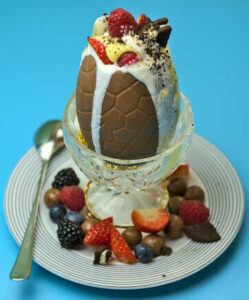 easter-sundae-fundae-homemade-ice-cream-ideas-for-easter-image-9-chocolate-egg-filled-with-ice-cream-topped-with-fresh-fruits-and-cream-frosted-fusions