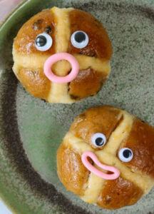 easter-treats-reinvented-hot-cross-buns-and-homemade-ice-cream-image-4-two-hot-cross-buns-with-fun-faces-frosted-fusions