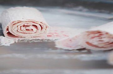 From-Scoop-To-Roll-Learn-To-Create-Your-Own-Homemade-Ice-Cream-Rolls-featured-image-200x650w-three-ice-cream-rolls-being-made-on-frozen-plate-with-spatula-rolling-one-frosted-fusions