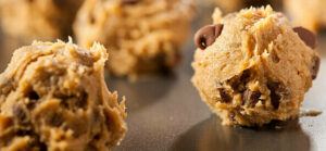 easy-homemade-cookie-dough-ice-cream-recipe-image-2-balls-of-cookie-dough-rolled-with-choc-chips-showing-frosted-fusions