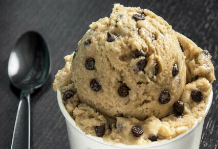 Easy Homemade Cookie Dough Ice Cream Recipe image 5 chocolate chip cookie dough ice cream scoop in white dish with silver spoon frosted fusions