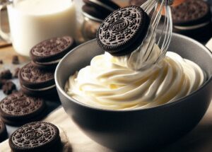 An-Irresistibly-Easy-Homemade-Oreo-Ice-Cream-Recipe-image-3-bowl-of-ice-cream-with-oreo-cookies-being-mixed-in-with-whisk-frosted-fusions