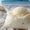 Bags-Of-Fun-–-Learn-How-To-Make-Homemade-Ice-Cream-In-A-Bag-Update-Apr25-featured-image-637x1920w-ziplock-bag-with-ice-cream-and-ice-and-salt-in-background-Frosted-Fusions