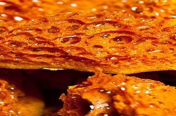Homemade-Honeycomb-Ice-Cream-A-Sweet-Treat-For-All-Ages-featured-image-200x620w-close-up-of-shards-of-golden-honeycomb-frosted-fusions